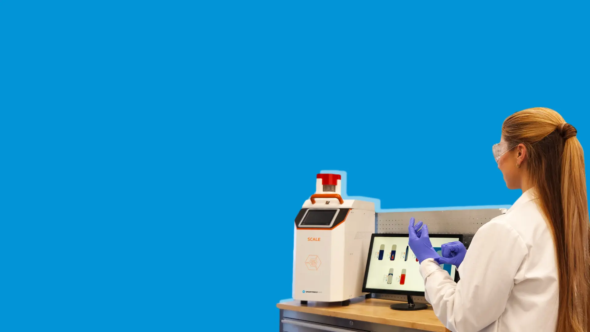 Scientist getting ready to work next to a table with SmartFreez products on it.